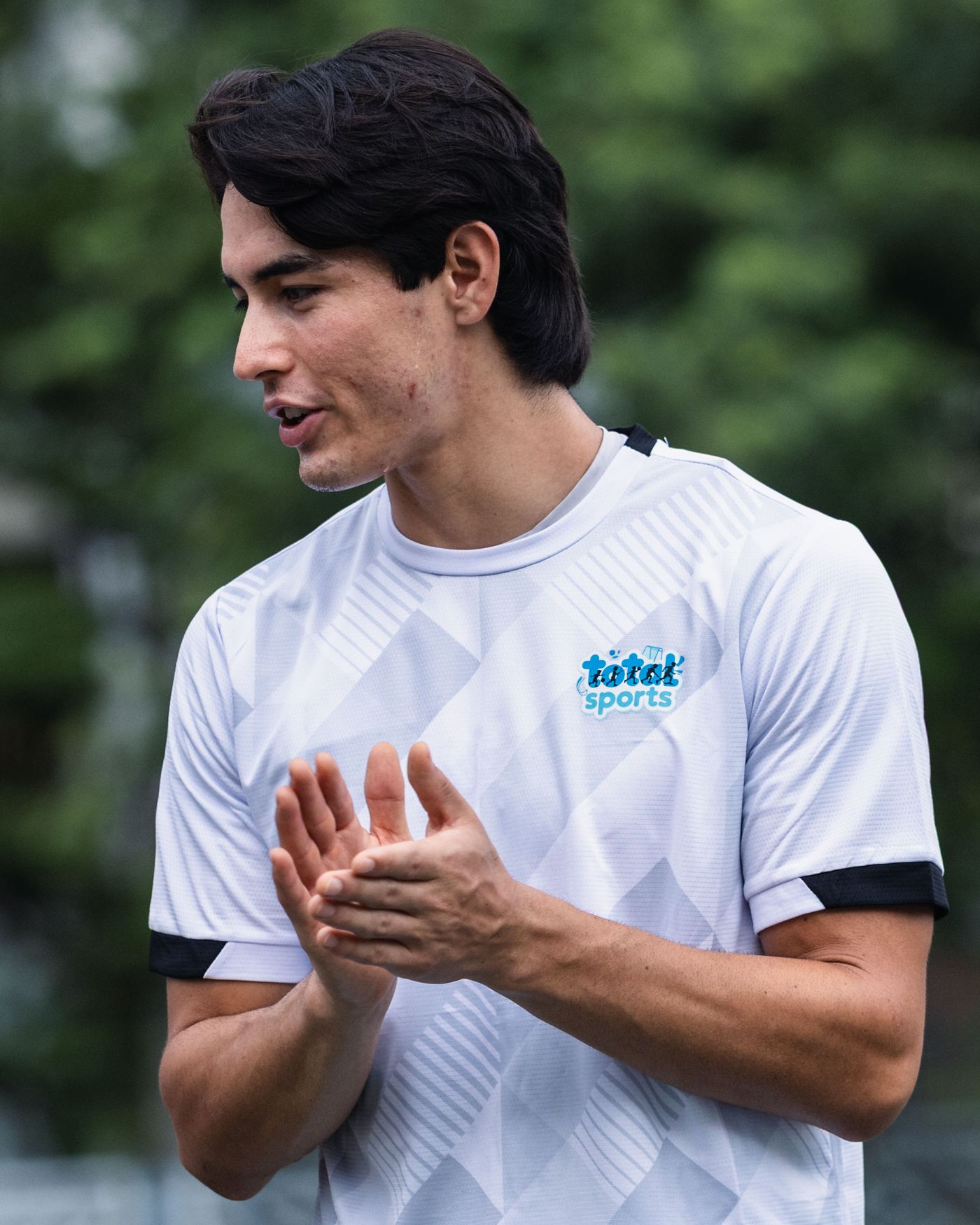 Total Sports coach encouraging students during a session