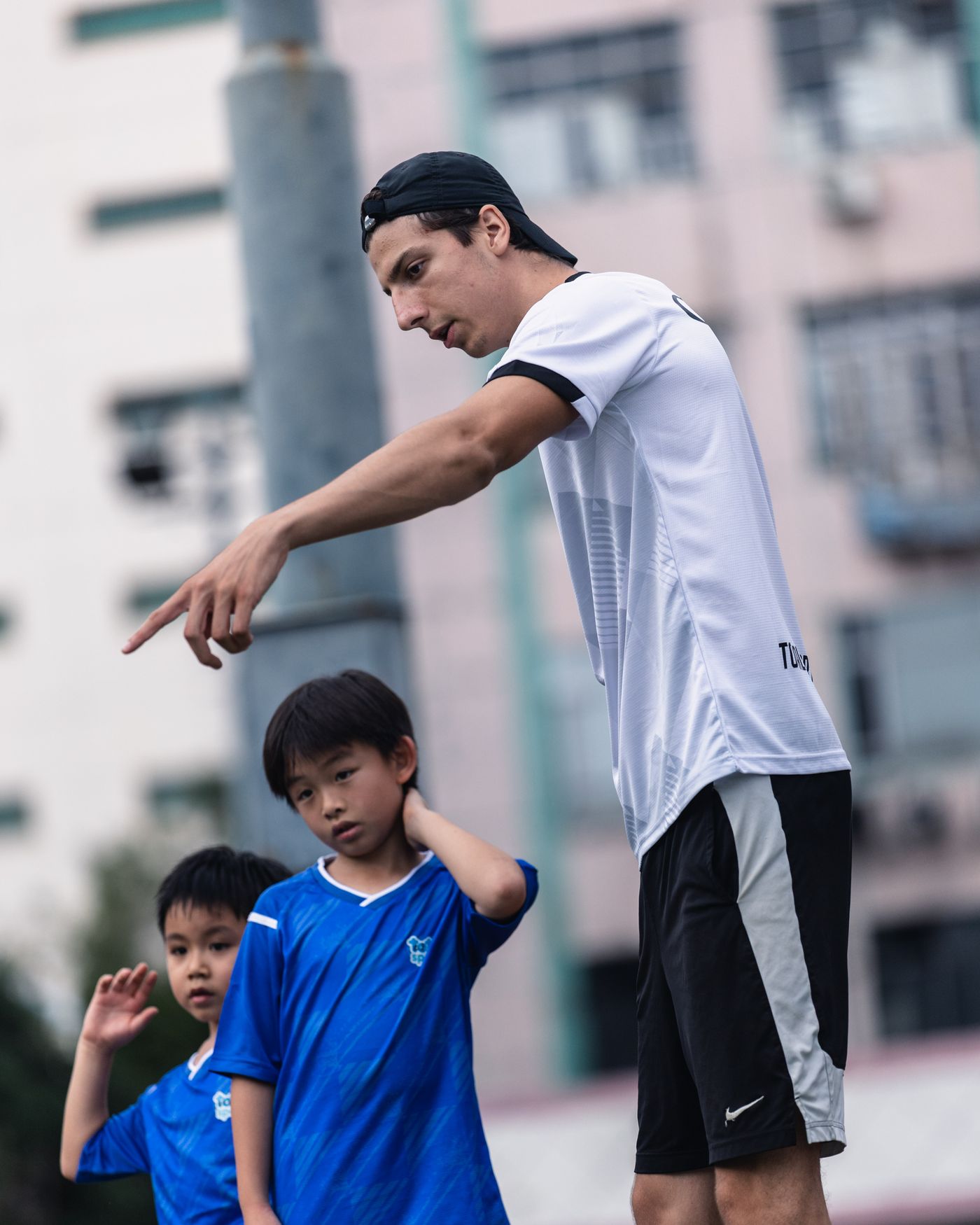 Coach talking a student through a drill