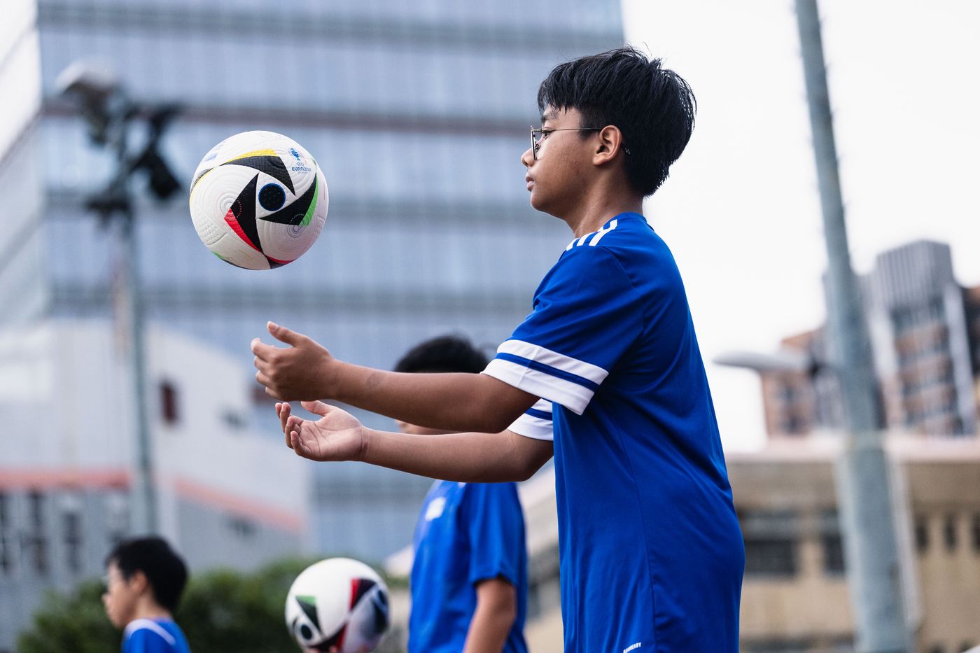 Student heading a ball