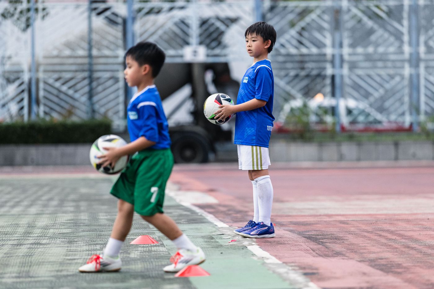 Kindergarten-age child with a football