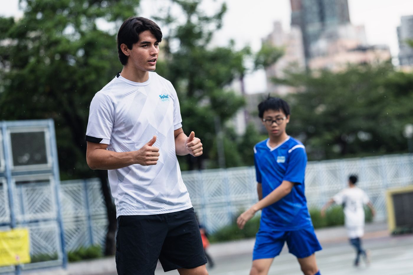 Coach and secondary student in training